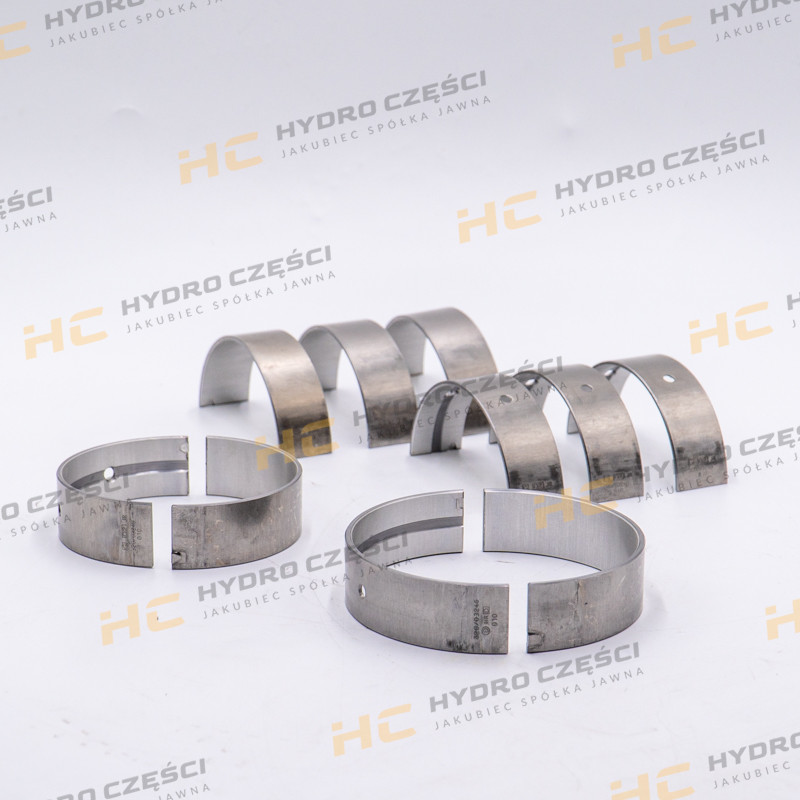 Втулки вала JCB +0,25 мм (верхняя/нижняя сторона с фиксатором) — AZERI PARTS